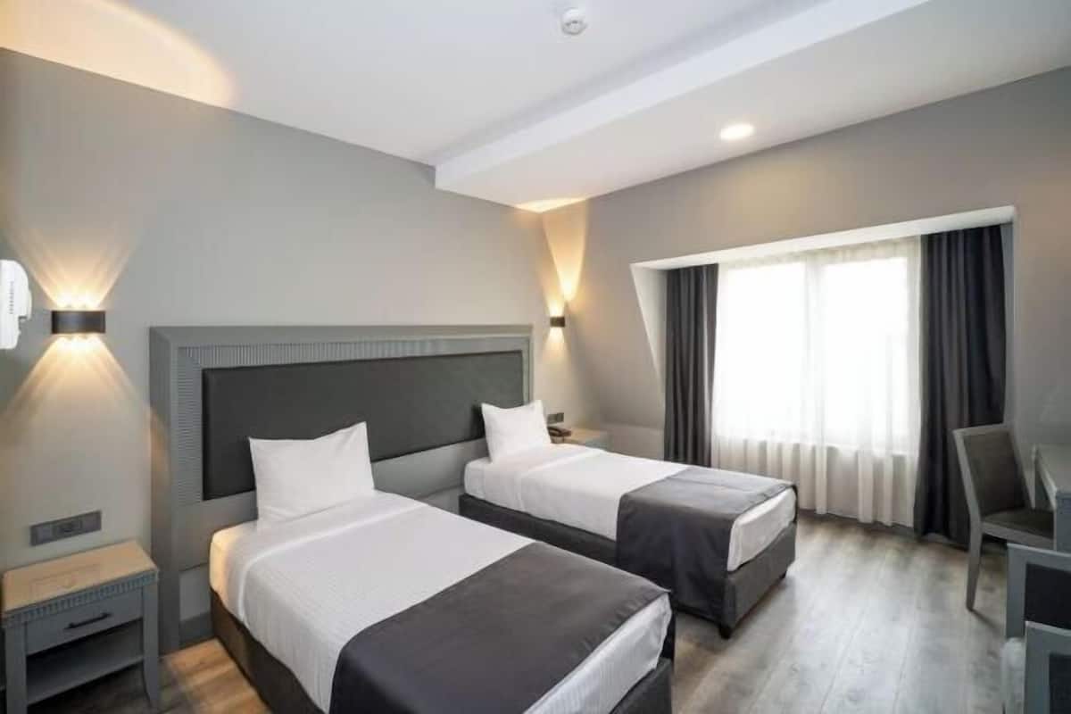 Luxe beddengoed, een minibar, een kluis op de kamer, een bureau