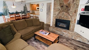 Superior Condo, 2 Bedrooms, Balcony, Pool View (105) | Living area | Flat-screen TV, fireplace, DVD player