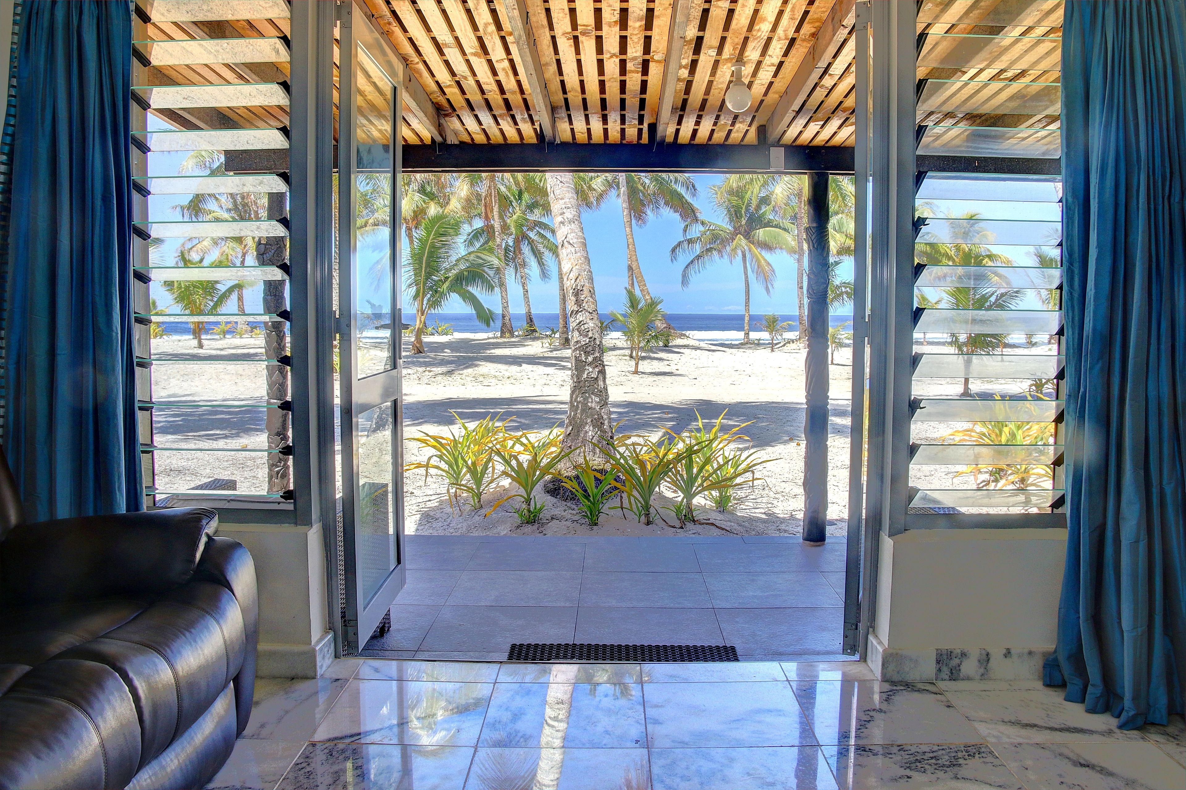 Beachfront Room | Living area | 31-inch LED TV with cable channels, TV, ping pong