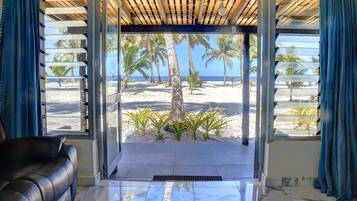 Beachfront Room | Living area | 31-inch LED TV with cable channels, TV, ping pong