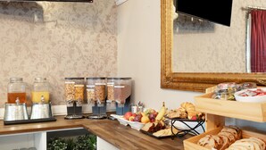 A breakfast buffet with various food items and beverages. - Coopers Colonial Motel (Acacia Ridge)