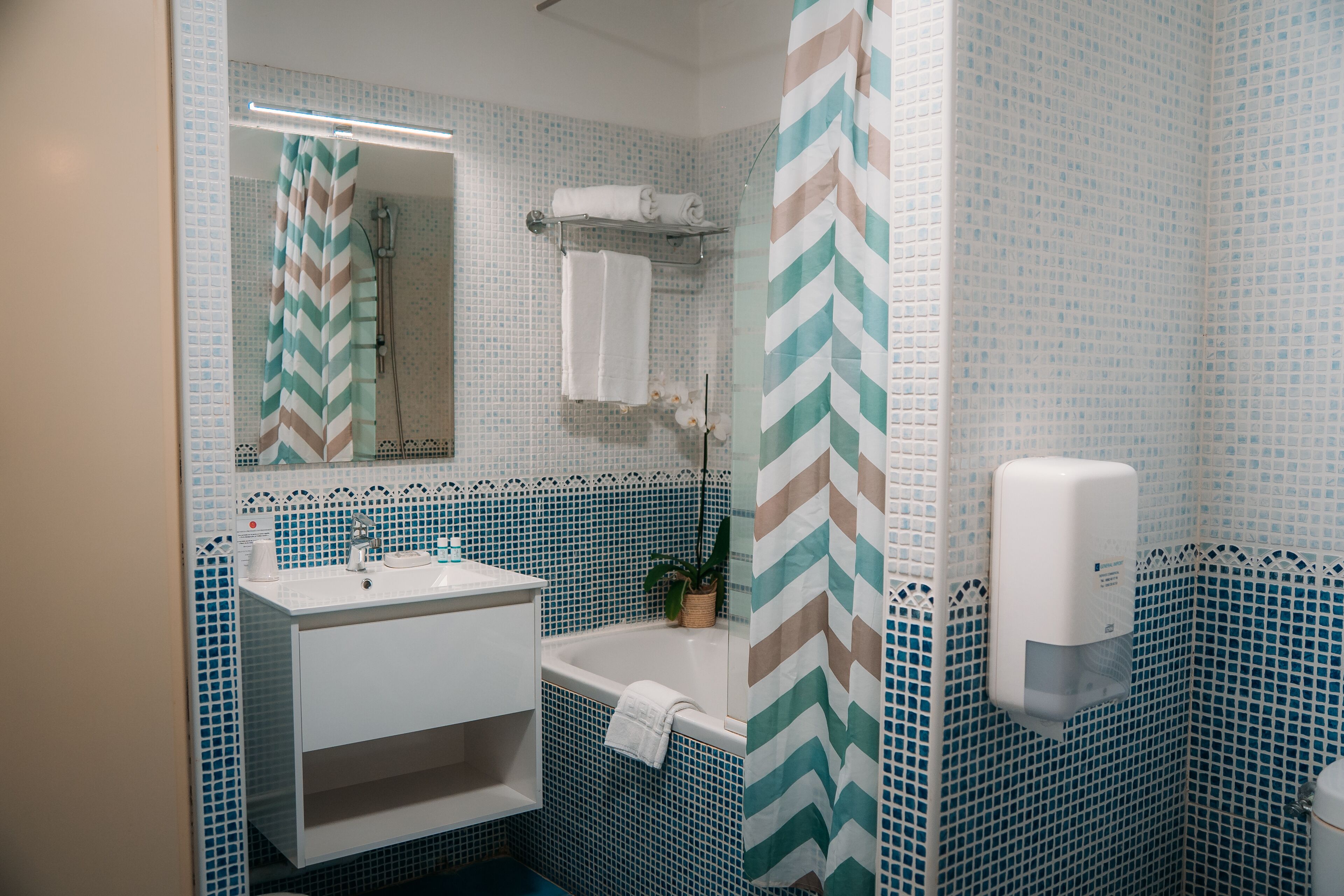 bathtub, free toiletries, hair dryer, towels