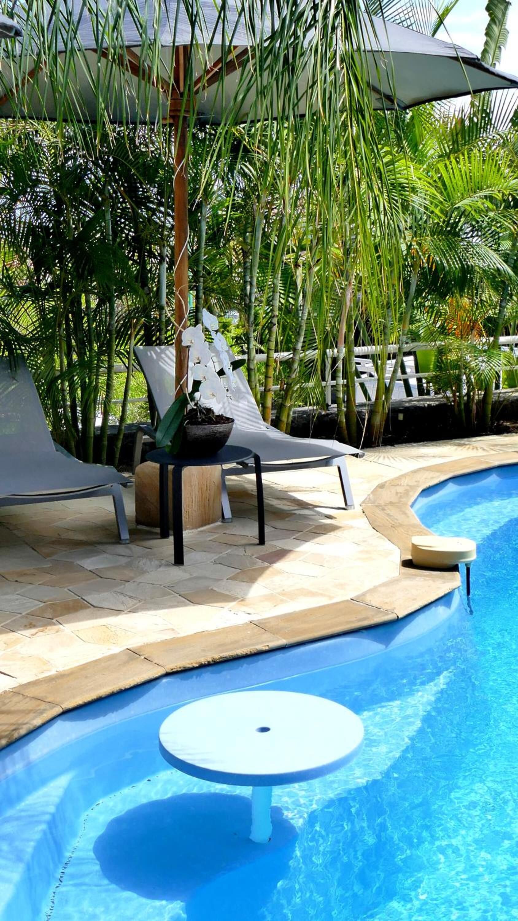 outdoor pool, pool umbrellas, pool loungers
