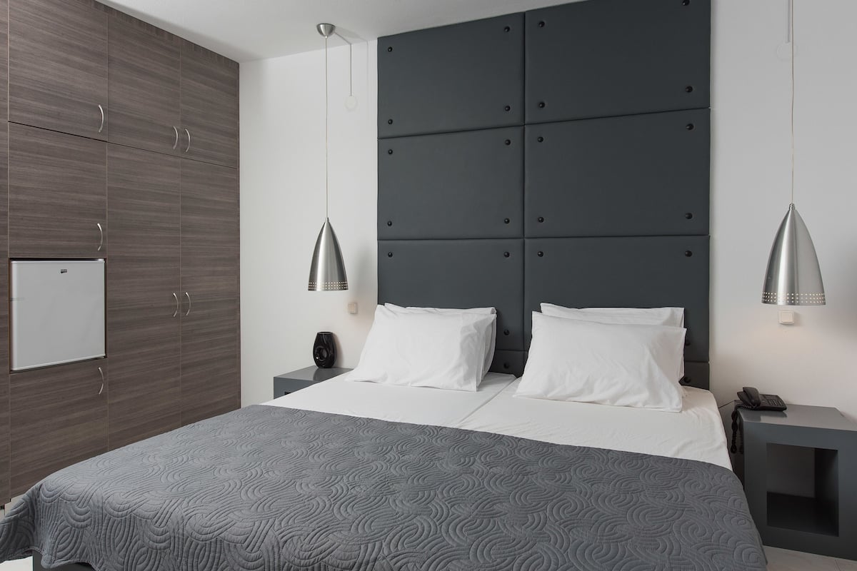 Standard Room, City View | Free minibar items, in-room safe, soundproofing, iron/ironing board