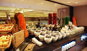 A buffet area with various food items and serving dishes. - Hurry Inn Merter Istanbul (Istanbul)