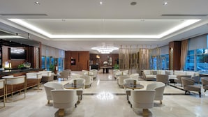 A spacious lobby with a bar area, seating arrangements, and a chandelier. - Miracle Istanbul Asia Airport Hotel & Spa (Istanbul)