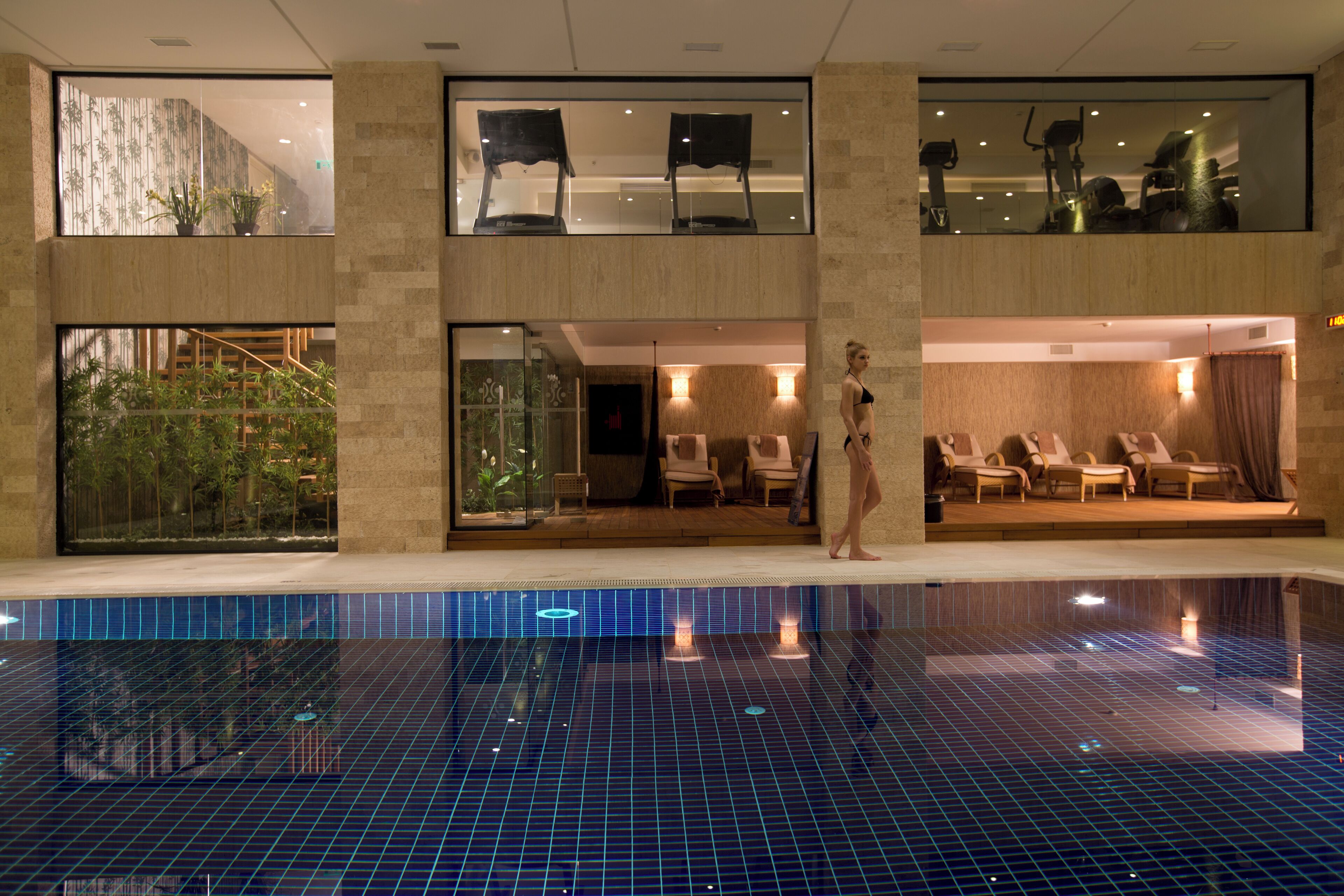 Indoor pool, outdoor pool, pool umbrellas, pool loungers