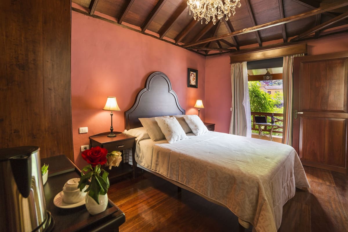 deluxe room | minibar, in-room safe, desk, blackout curtains