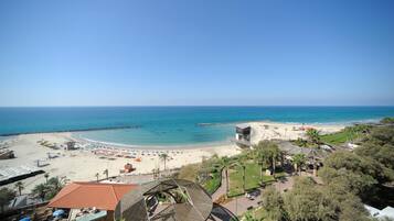 On the beach, sun-loungers, beach towels