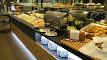 Enjoy a diverse spread of international cuisine at our buffet, featuring a variety of dishes and refreshments.