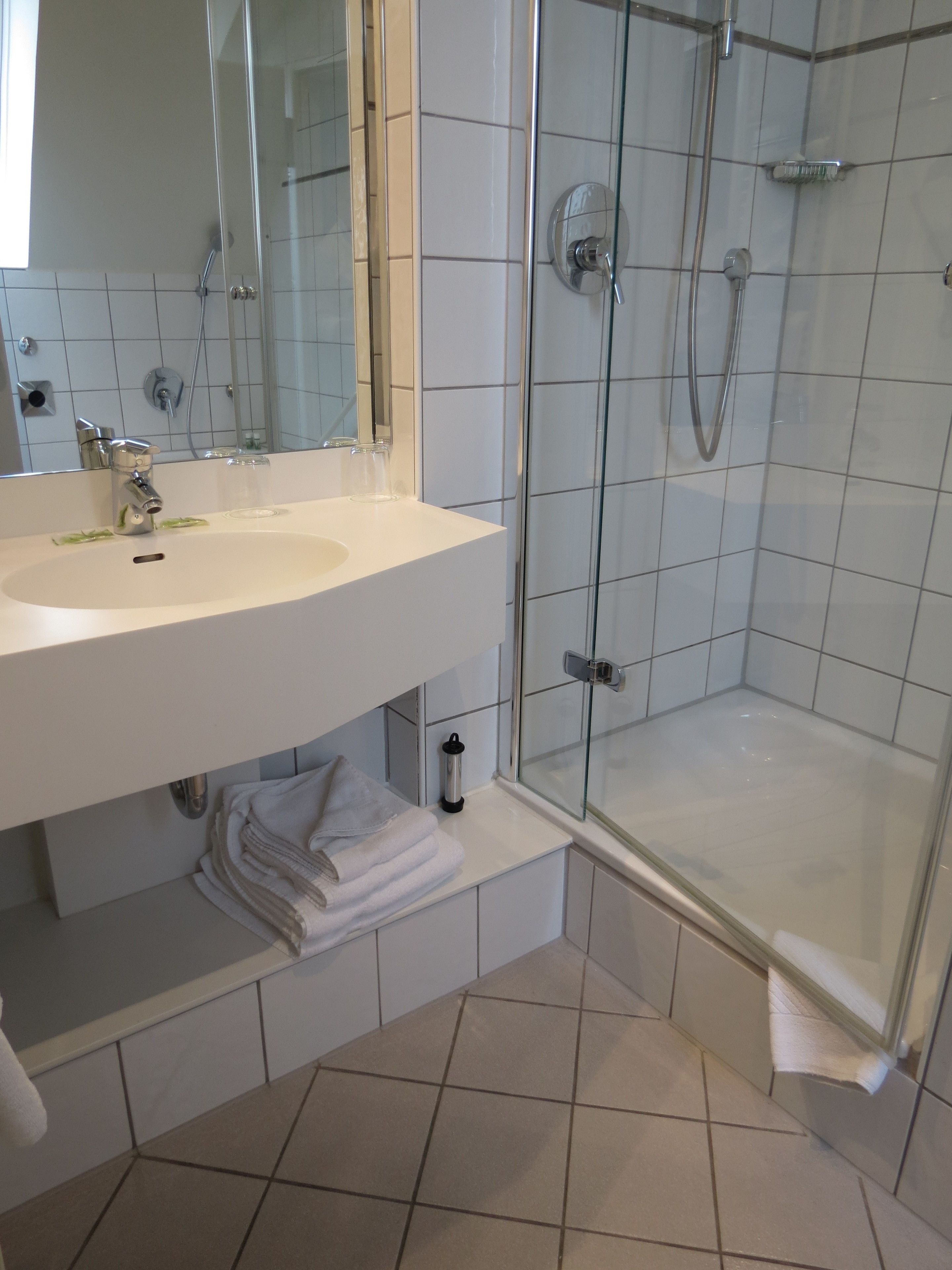economy quadruple room (bed 140 cm wide) | bathroom | shower, free toiletries, hair dryer, towels
