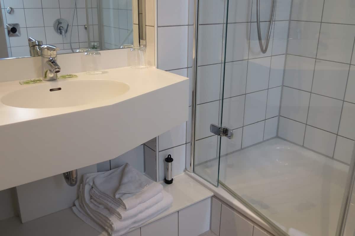 economy quadruple room (bed 140 cm wide) | bathroom | shower, free toiletries, hair dryer, towels
