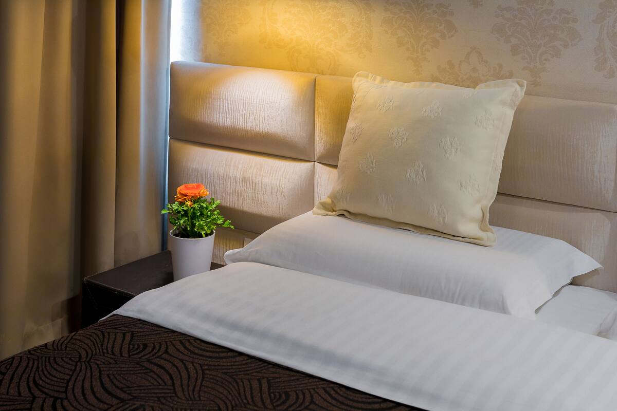 Standard Double Room | Minibar, in-room safe, desk, blackout drapes