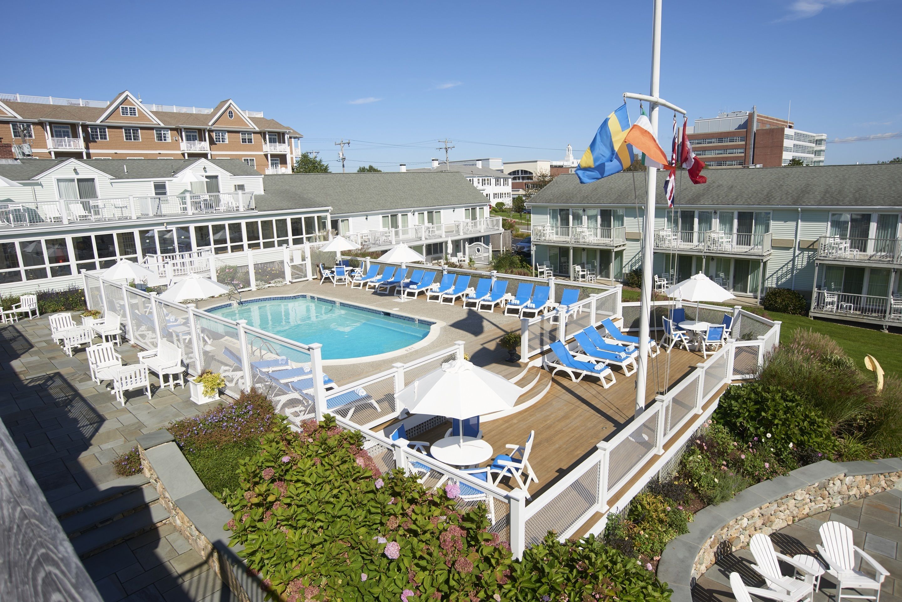 seasonal outdoor pool, pool umbrellas, pool loungers