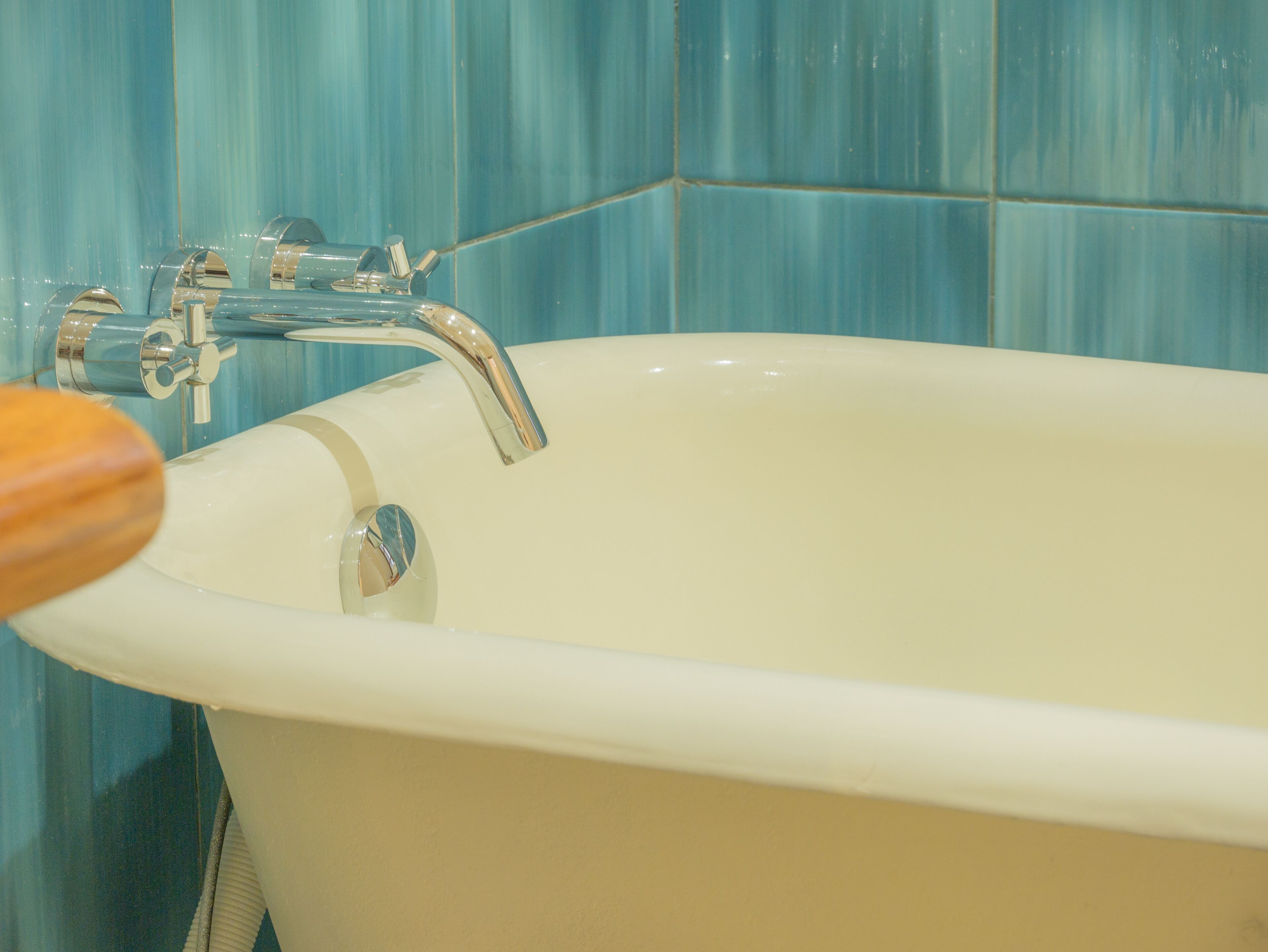 deluxe room | bathroom | shower, rainfall showerhead, free toiletries, hair dryer