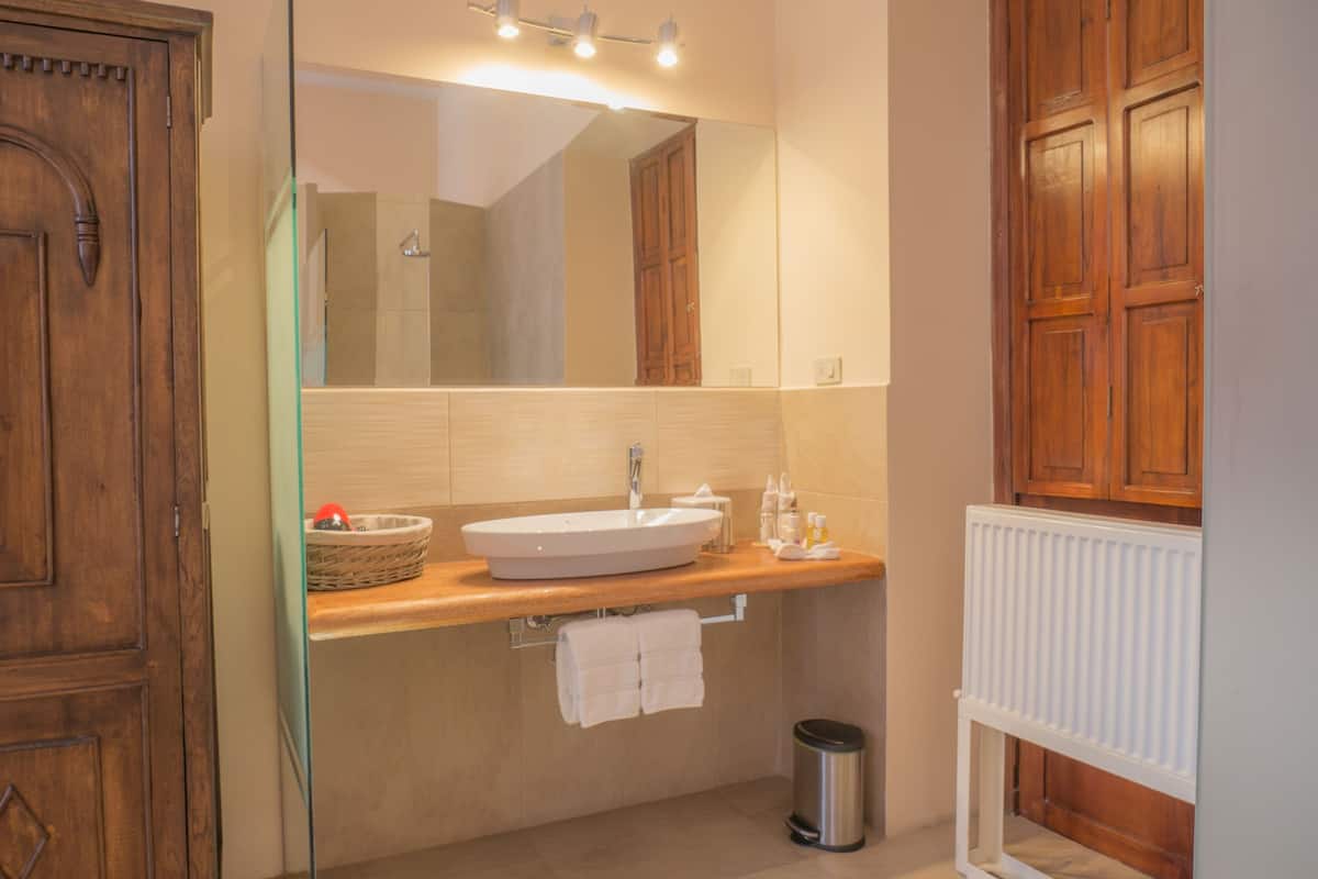 superior room | bathroom | shower, rainfall showerhead, free toiletries, hair dryer