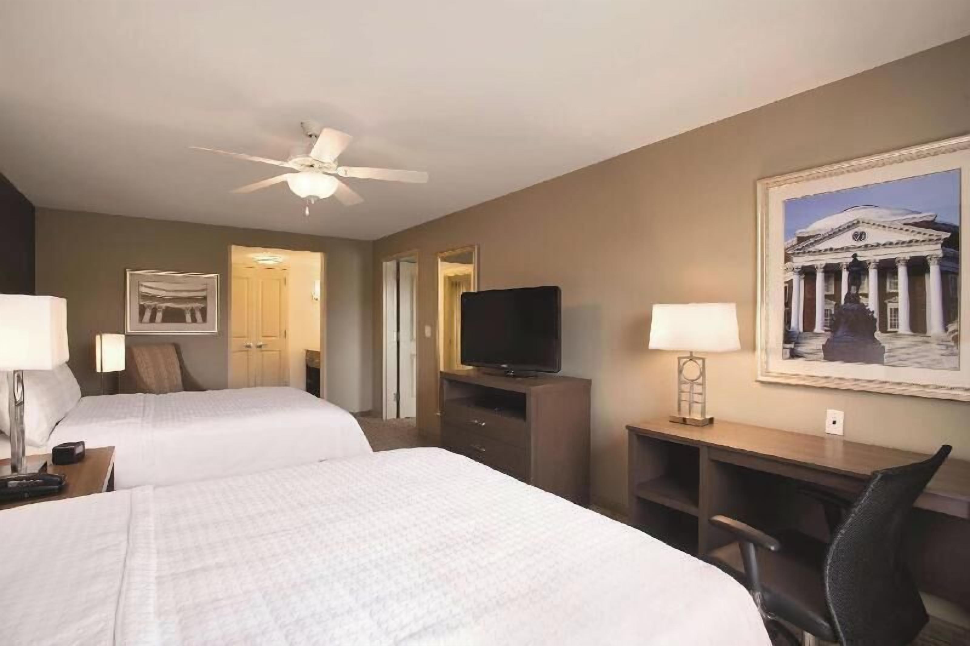 Premium bedding, desk, laptop workspace, blackout curtains