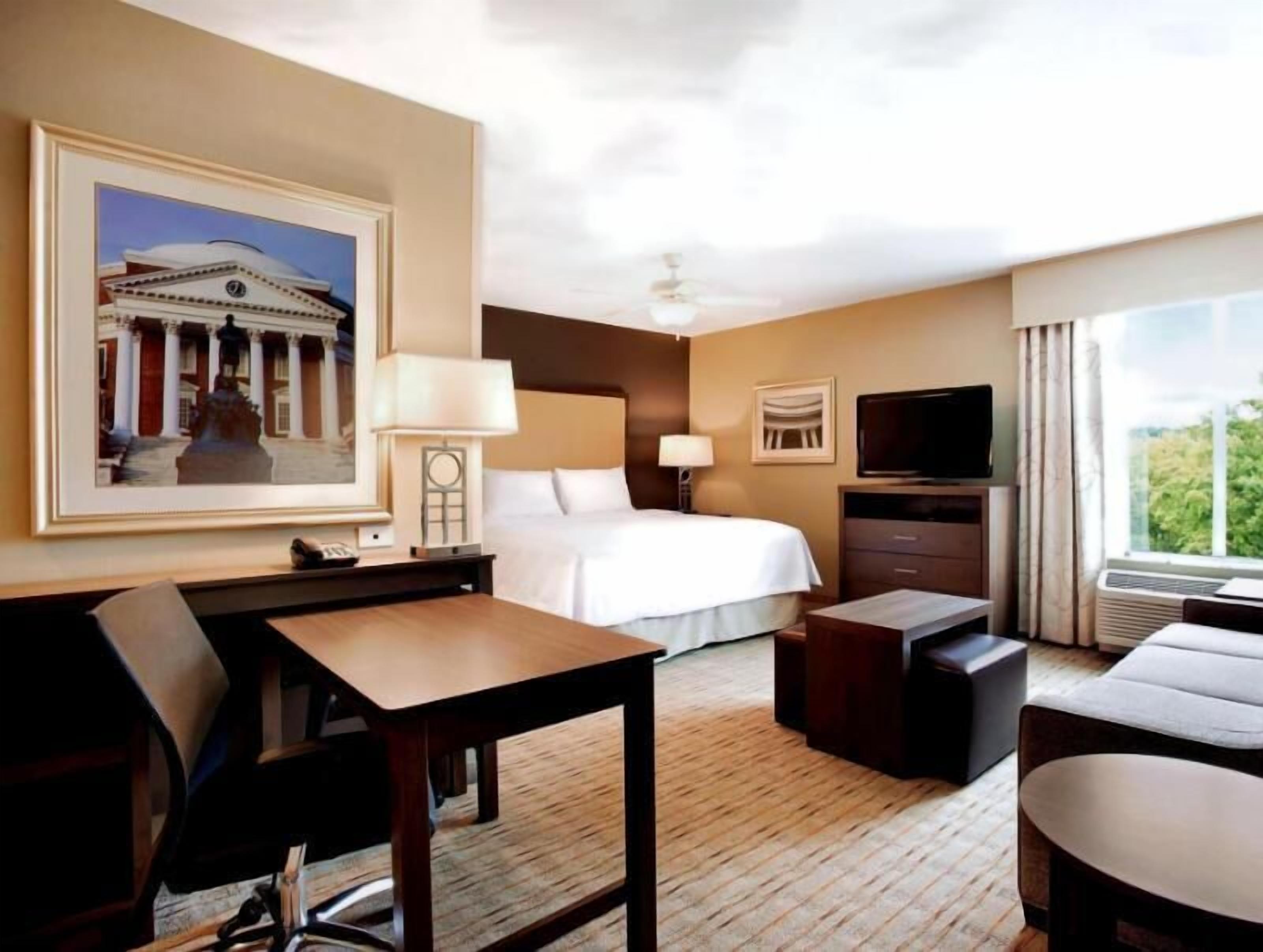 Premium bedding, desk, laptop workspace, blackout curtains