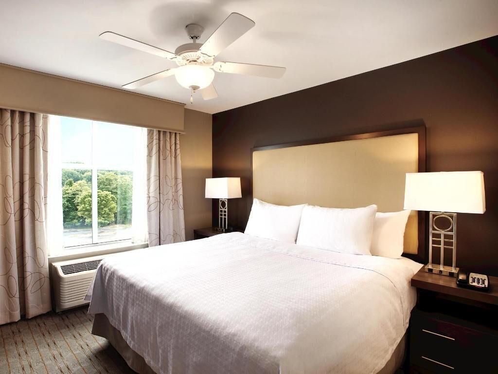 Premium bedding, desk, laptop workspace, blackout curtains