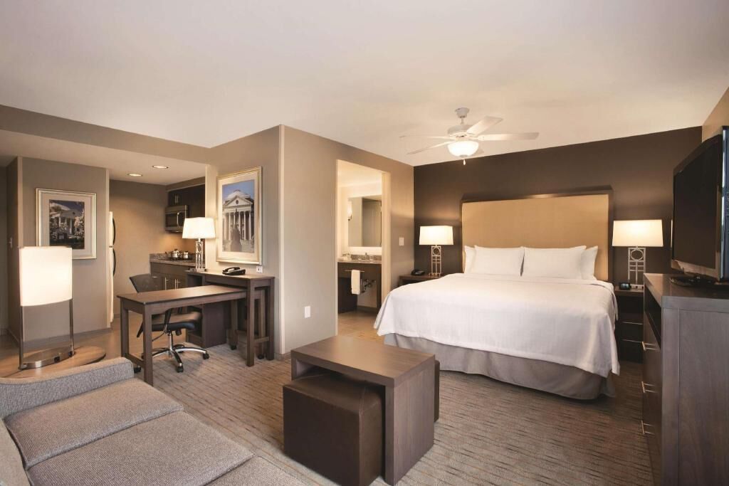 Premium bedding, desk, laptop workspace, blackout curtains