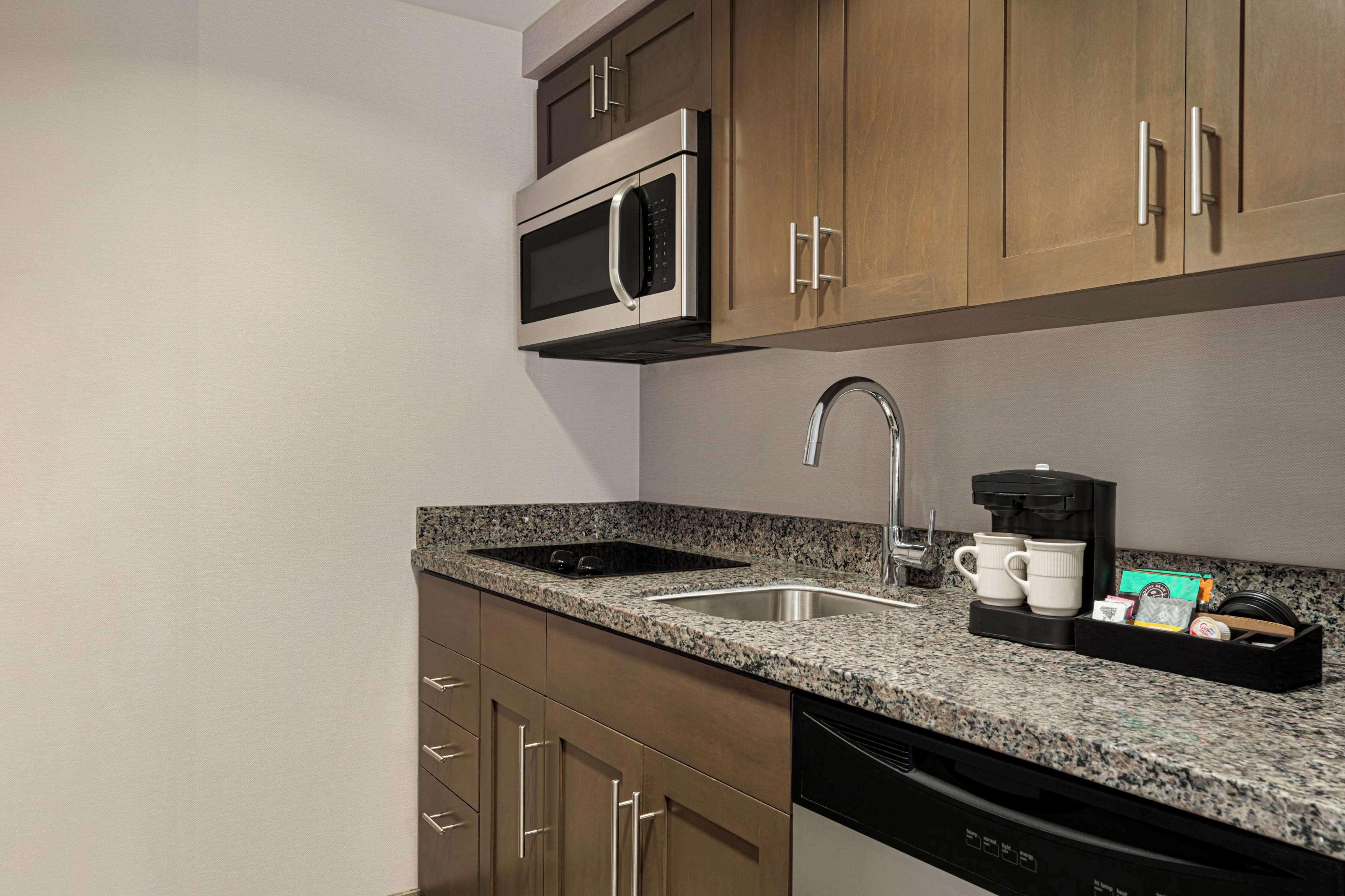 studio suite, 1 king bed with sofa bed | private kitchen | full-sized fridge, microwave, stovetop, dishwasher