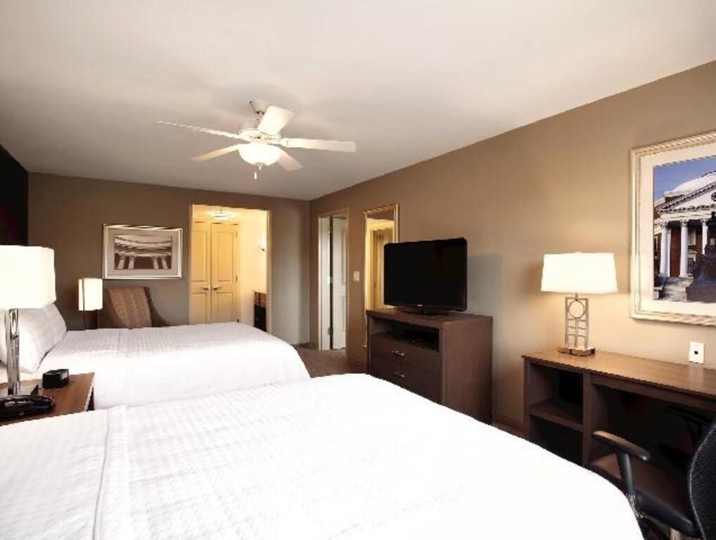 Premium bedding, desk, laptop workspace, blackout curtains