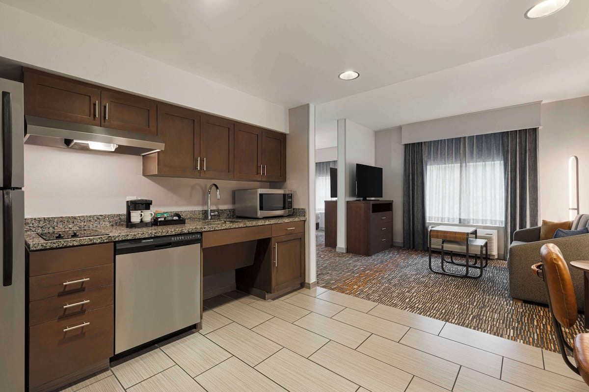 studio suite, 1 king bed with sofa bed (hearing accessible) | private kitchen | full-sized fridge, microwave, stovetop, dishwasher