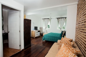Deluxe Double Room | Living area | 24-inch LCD TV with cable channels, TV