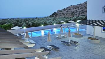 Outdoor pool, pool umbrellas, pool loungers