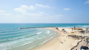 On the beach, sun-loungers, beach towels