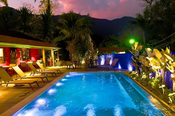 Outdoor pool, open 8 AM to 10 PM, pool umbrellas, pool loungers