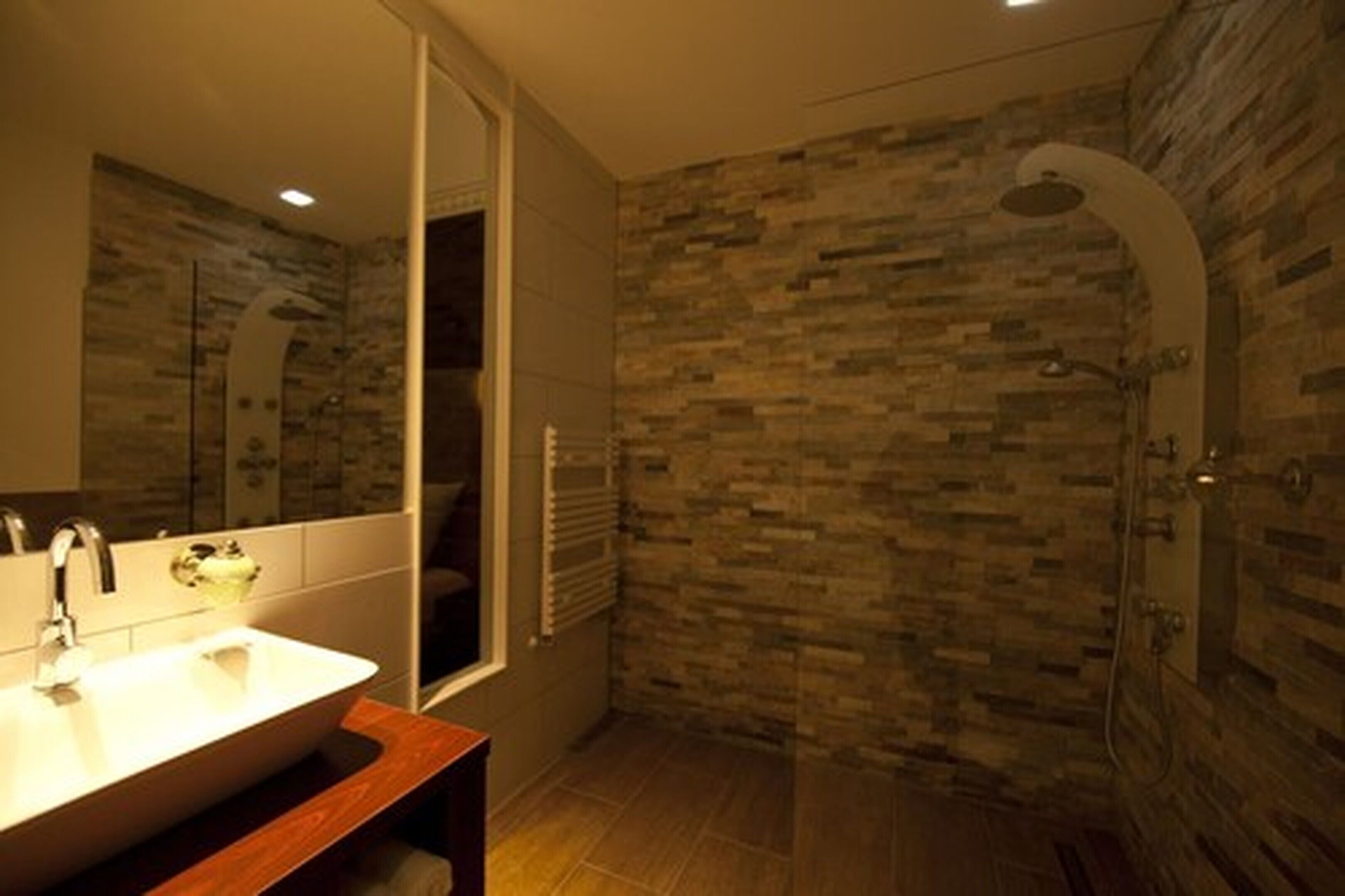 deluxe double room | bathroom | eco-friendly toiletries, hair dryer, towels