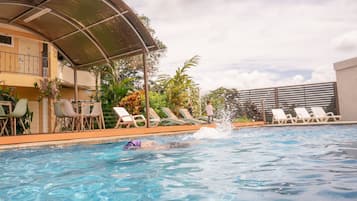 Outdoor pool, open 7:00 AM to 9:00 PM, pool loungers