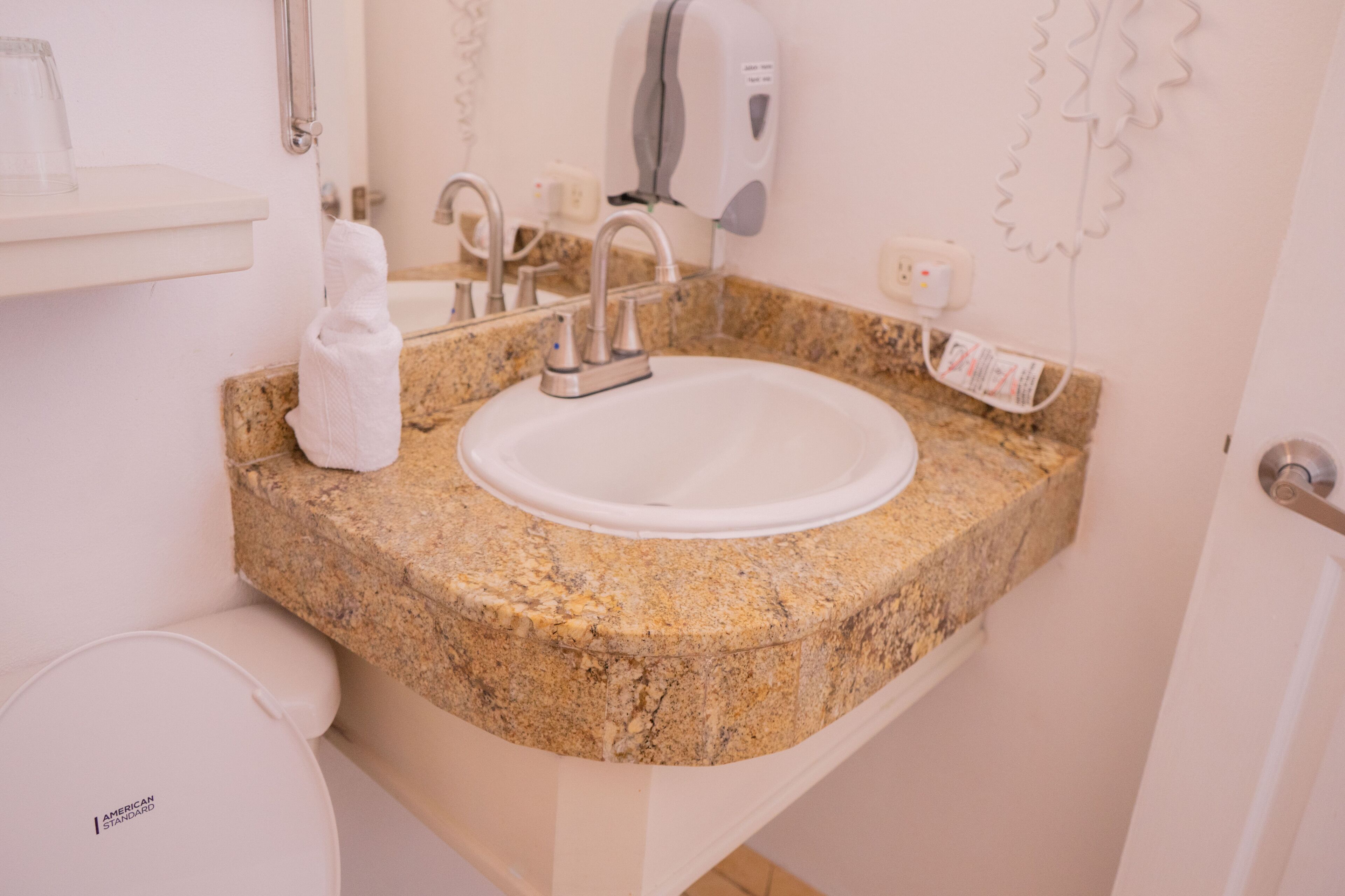 shower, designer toiletries, hair dryer, towels