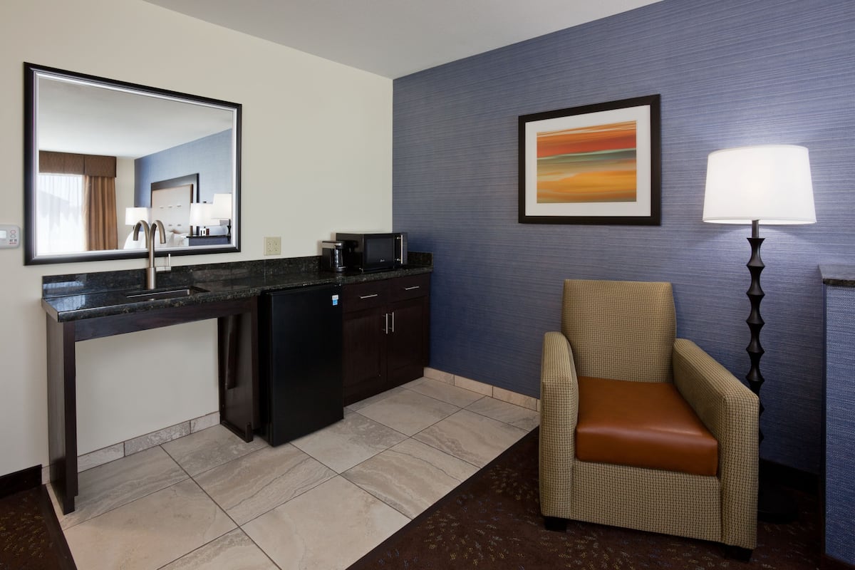 Desk, laptop workspace, blackout drapes, iron/ironing board