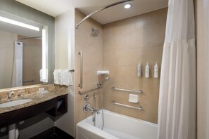 A modern bathroom with a large sink, a shower with a handheld showerhead, and a bathtub. - Hilton Garden Inn Washington DC/Georgetown Area (Washington)