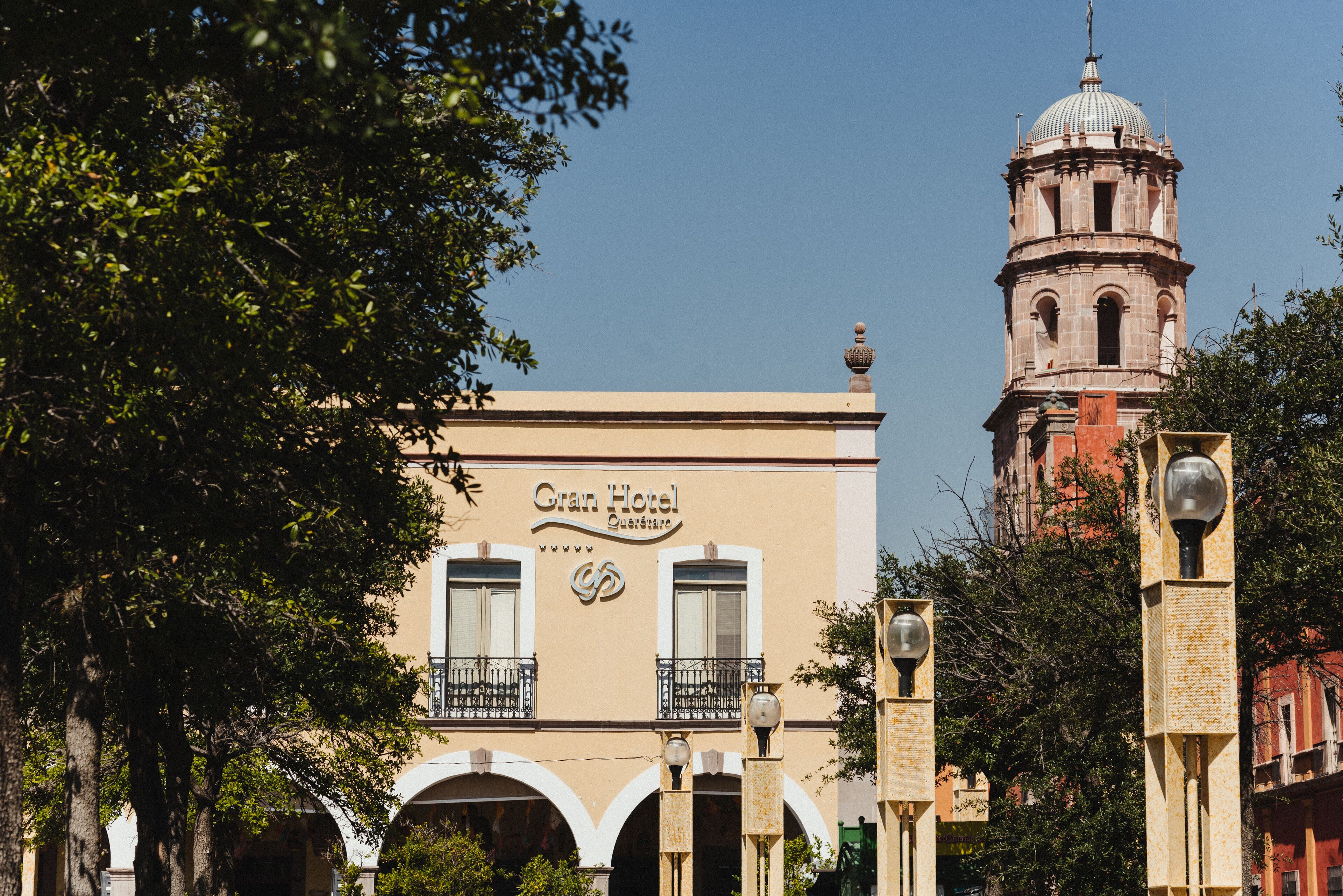 A hotel with a prominent dome and arched windows.