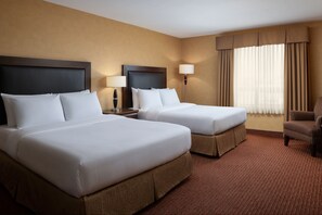 Premium bedding, pillow-top beds, desk, laptop workspace