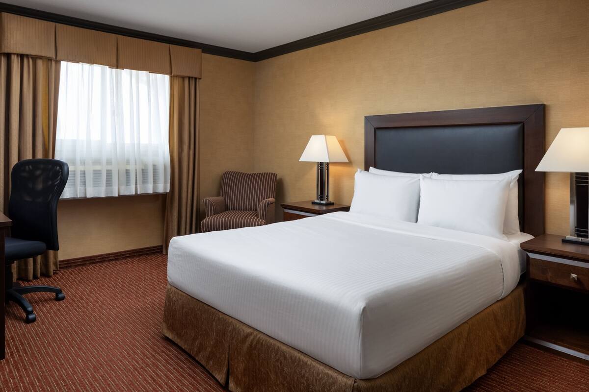 premium bedding, pillow-top beds, desk, laptop workspace