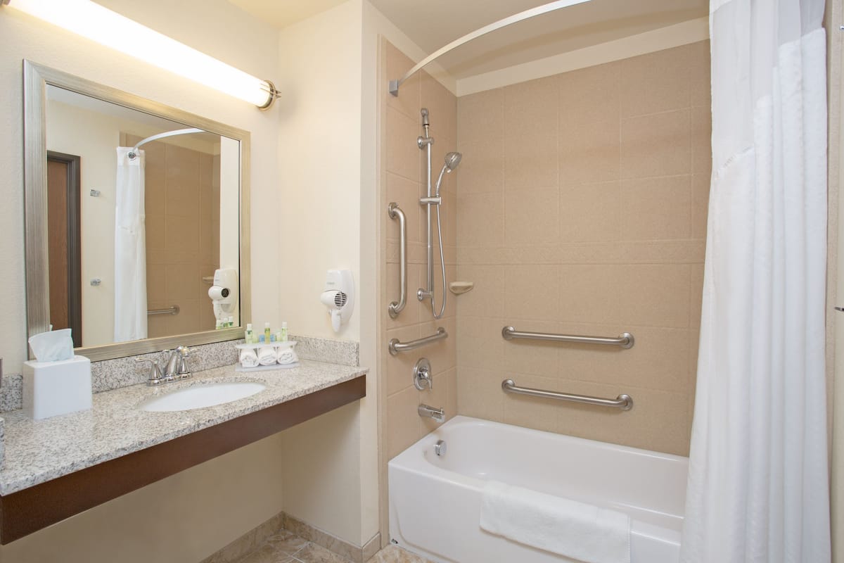 suite, 1 bedroom, accessible (mobility tub) | bathroom | free toiletries, hair dryer, towels, soap