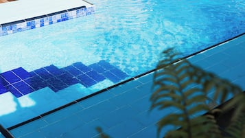 Outdoor pool, open 8:00 AM to 7:00 PM, pool loungers