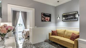 Luxury Suite, 2 Bedrooms | Living area | 42-inch LCD TV with satellite channels, TV