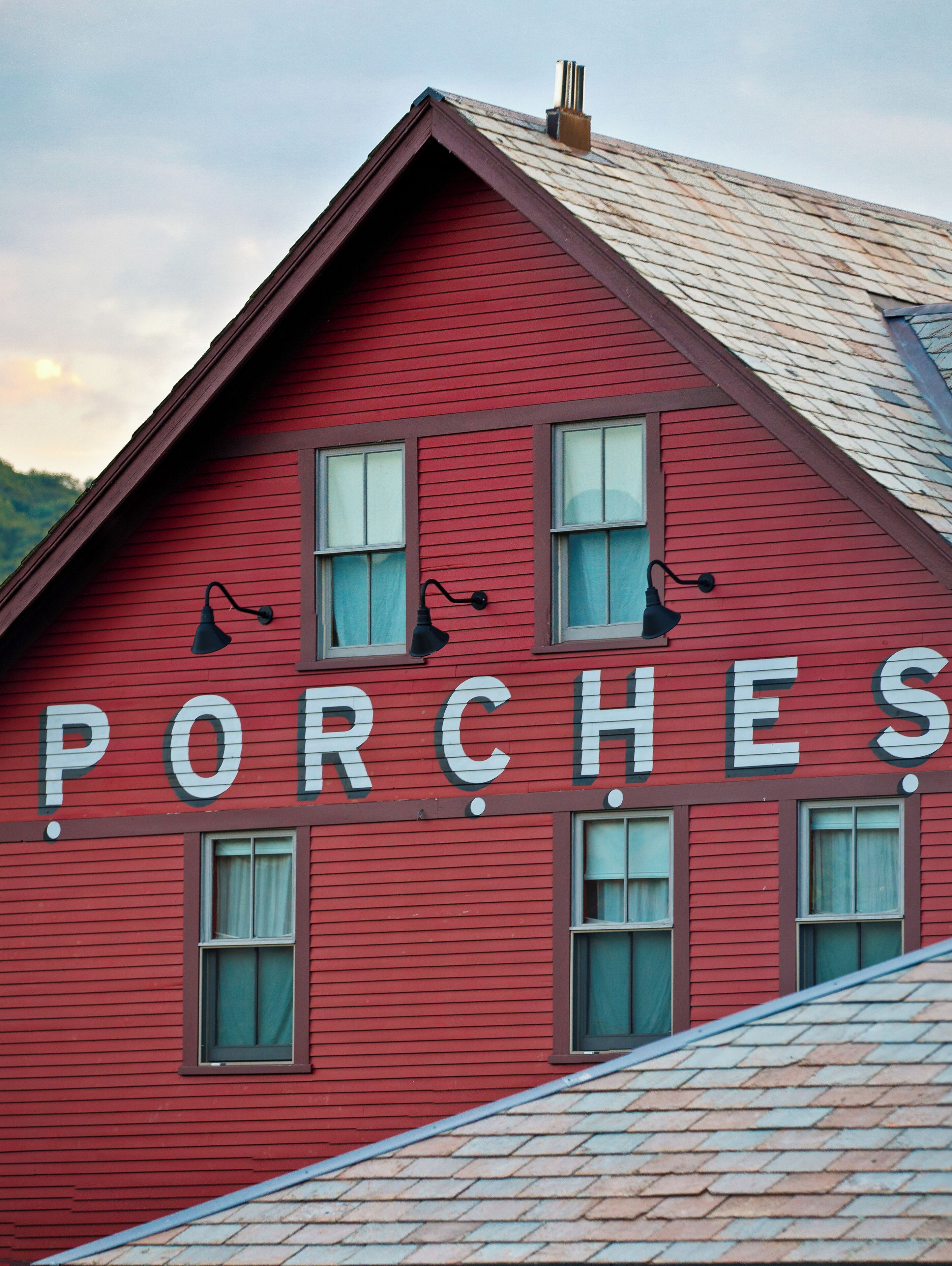 A red building with the word "PORCHES" on the side.
