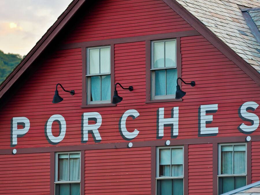 A red building with the word "PORCHES" on the side.