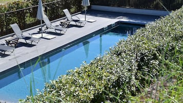Outdoor pool, pool umbrellas, pool loungers