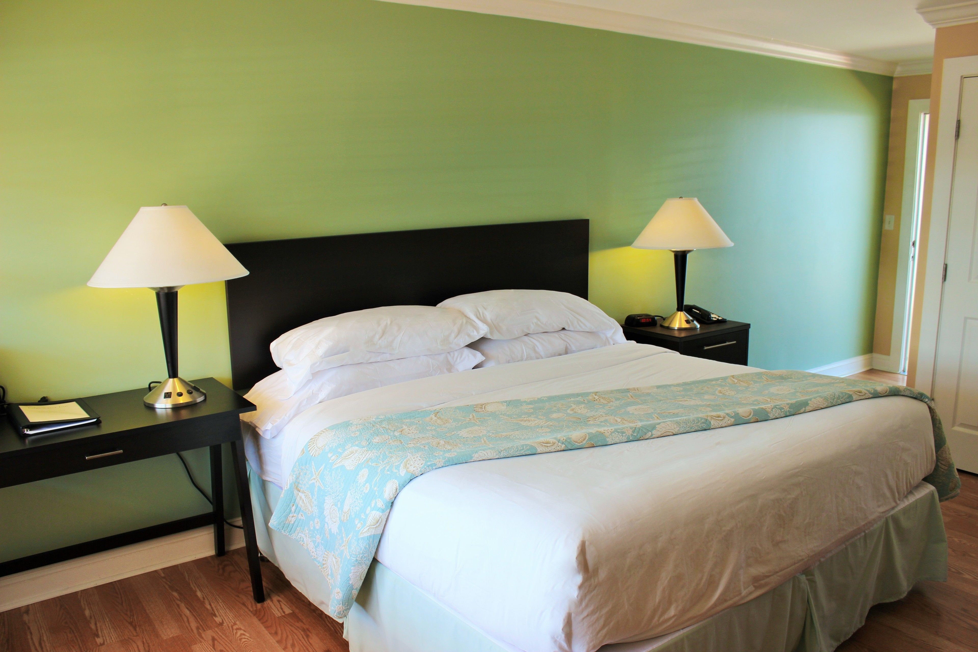 signature room, 1 king bed, patio, bay view | down duvets, desk, iron/ironing board, free wifi