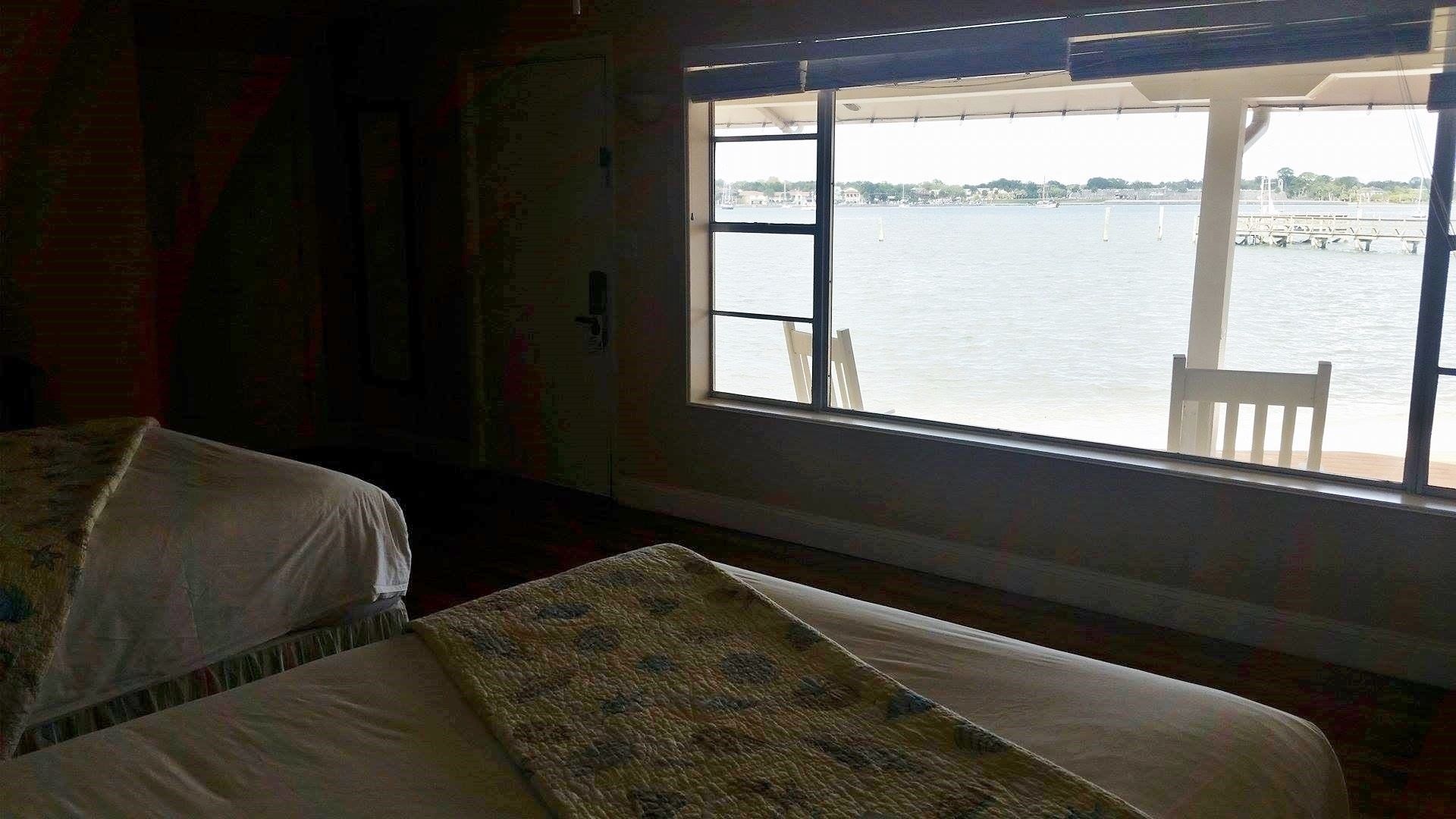 signature room, 2 double beds, patio, bay view | down duvets, desk, iron/ironing board, free wifi