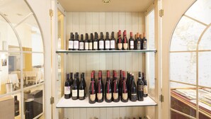 A wine cellar with shelves of wine bottles. - Hotel Ristorante Continental (Osio Sotto)