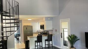 Premium Loft, 1 Bedroom, 2 Bathrooms, Lakeside | Living area | TV, fireplace, ping pong