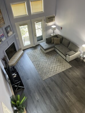 Premium Loft, 1 Bedroom, 2 Bathrooms, Lakeside | Living area | TV, fireplace, table tennis - Caribbean Club Resort (Wisconsin Dells)